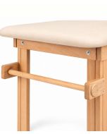 Portarotolo per lenzuolino installato sul lettino in legno