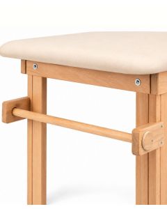 Portarotolo per lenzuolino installato sul lettino in legno